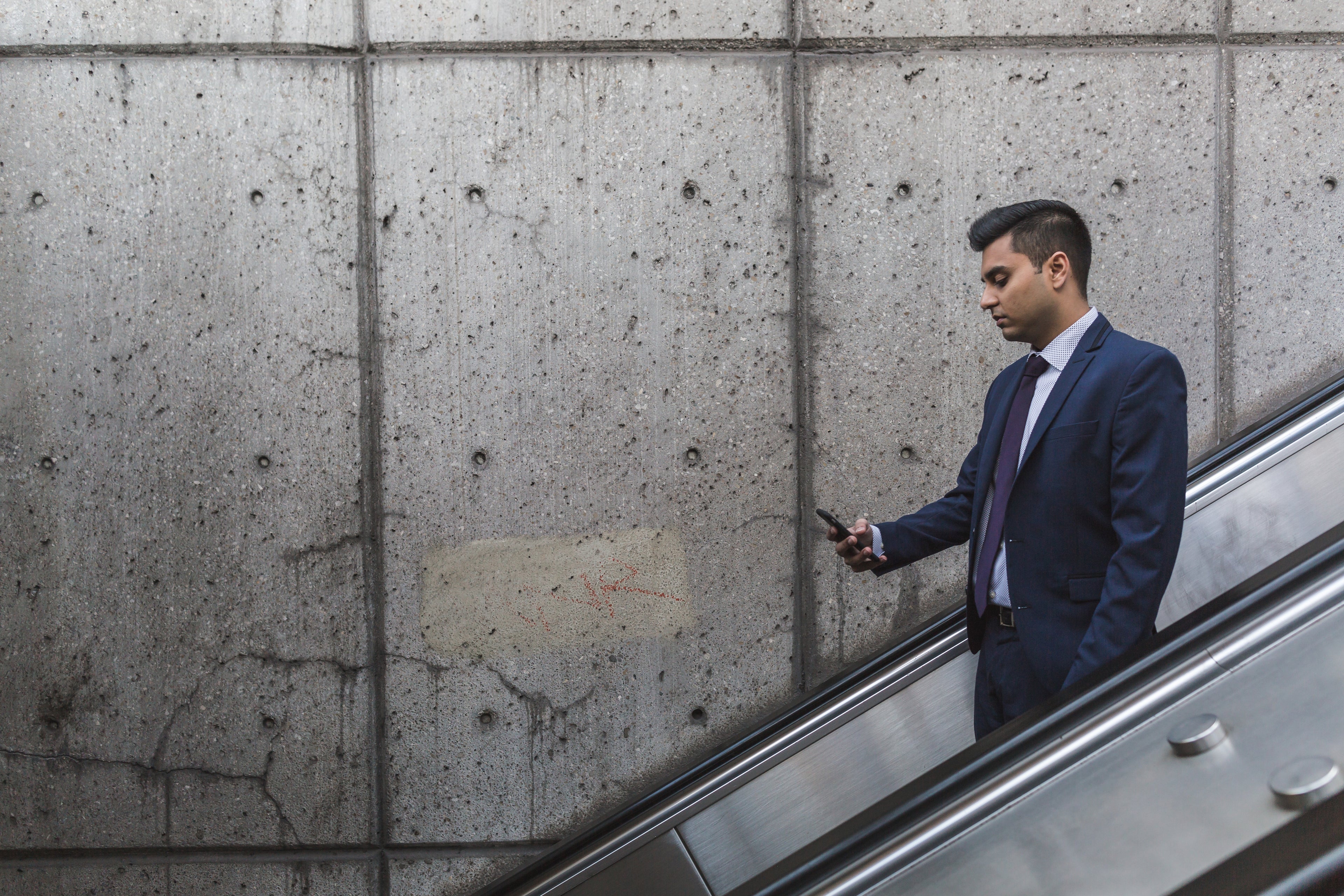 Businessman working on a cell phone.
